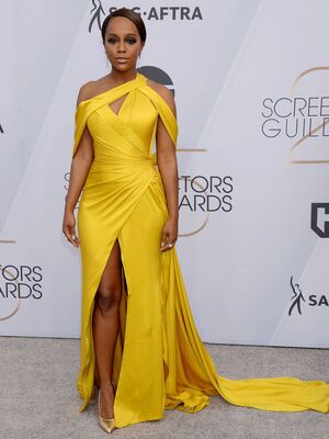 Aja Naomi King in yellow dress at 25th Annual Screen Actors Guild Awards in Los Angeles